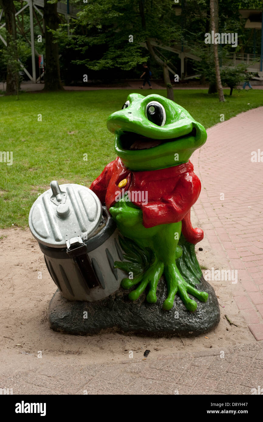 Green frog Litter Bin encourage children to use Stock Photo