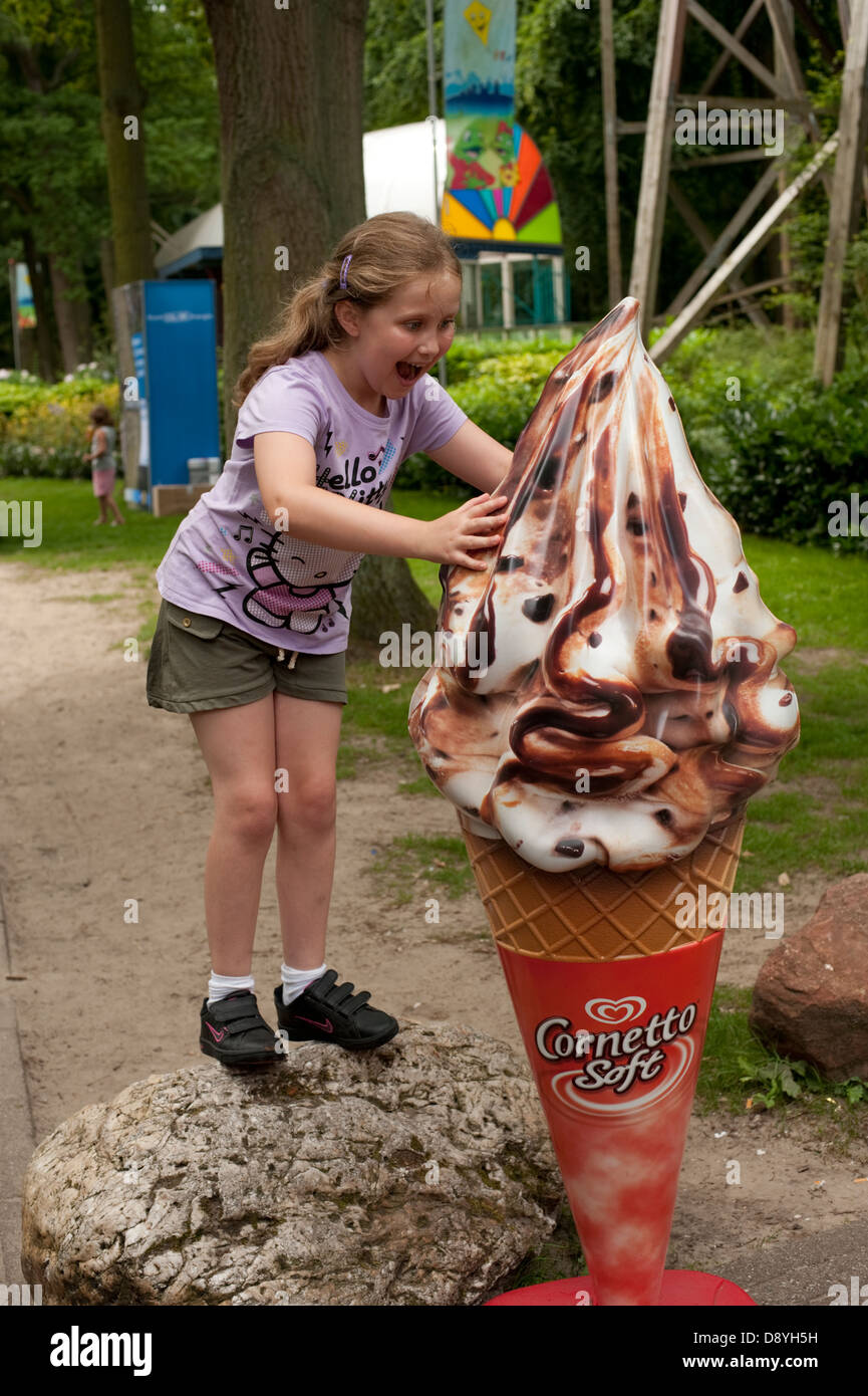 Girl excited huge big ice cream cone FULLY MODEL RELEASED Stock Photo