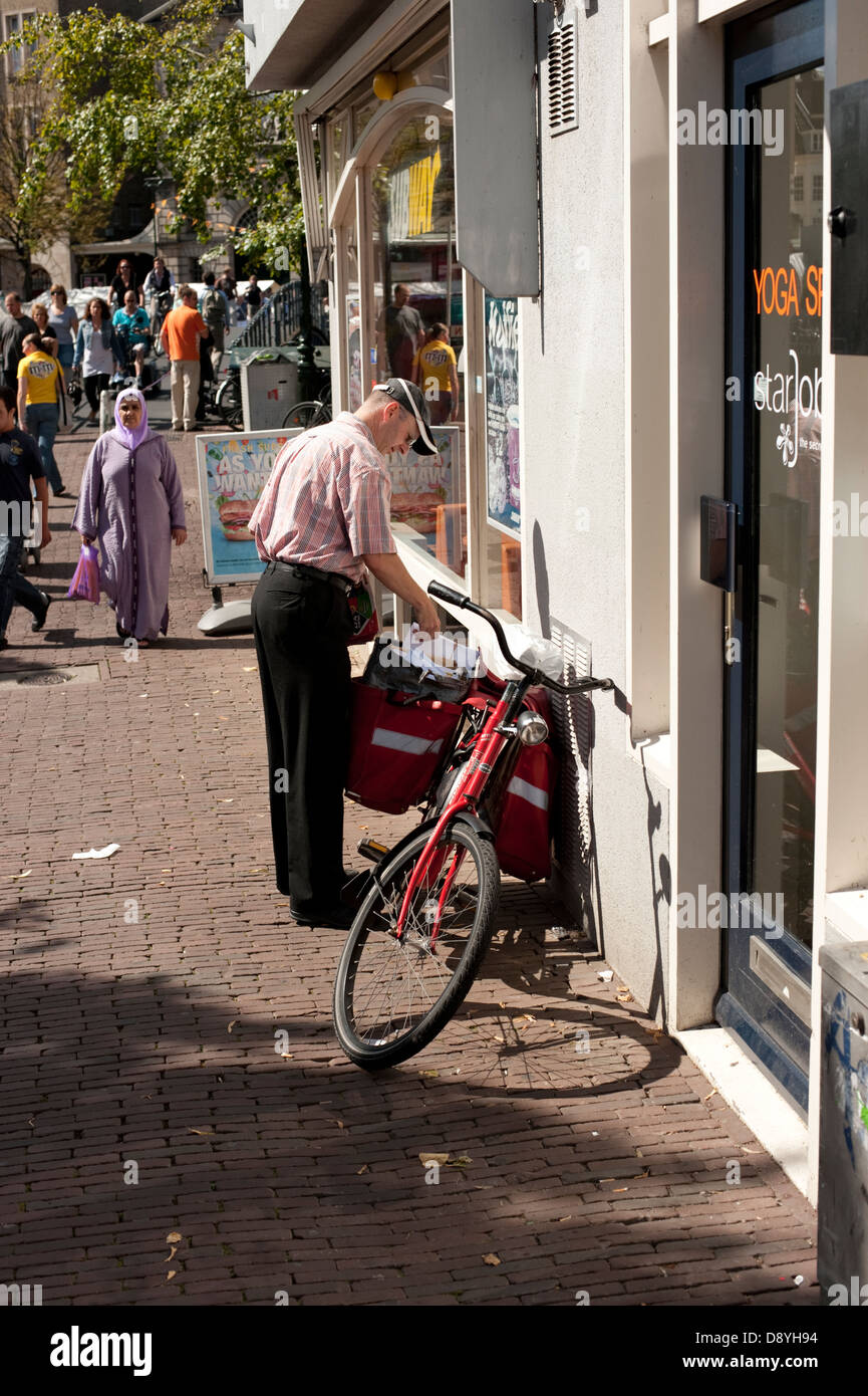 Post man Mail Delivery Dutch Leiden Holland Netherlands Europe Stock Photo