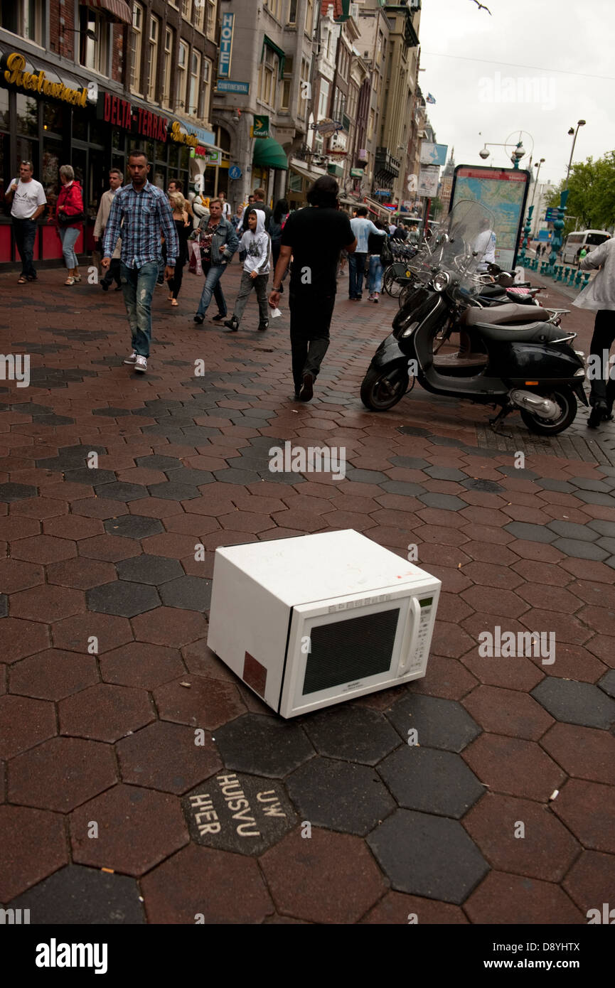 Abandoned dumped Microwave oven pavement Amsterdam Holland Netherlands