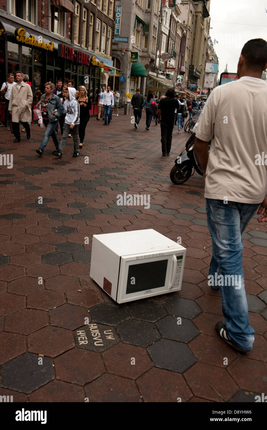 Abandoned dumped Microwave oven pavement Amsterdam Holland Netherlan Stock Photo