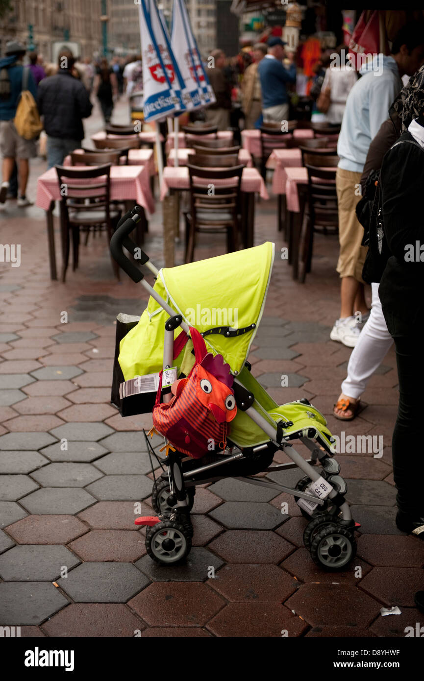 Bright Green child's pram stroller children's Stock Photo