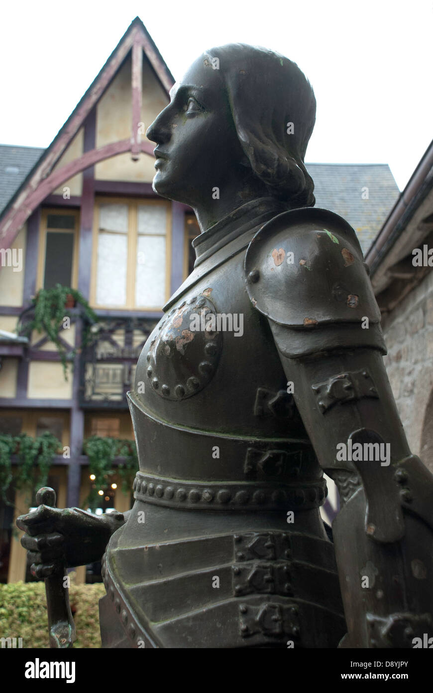 A statue of Joan of Arc guarding the entrance of the parish church on