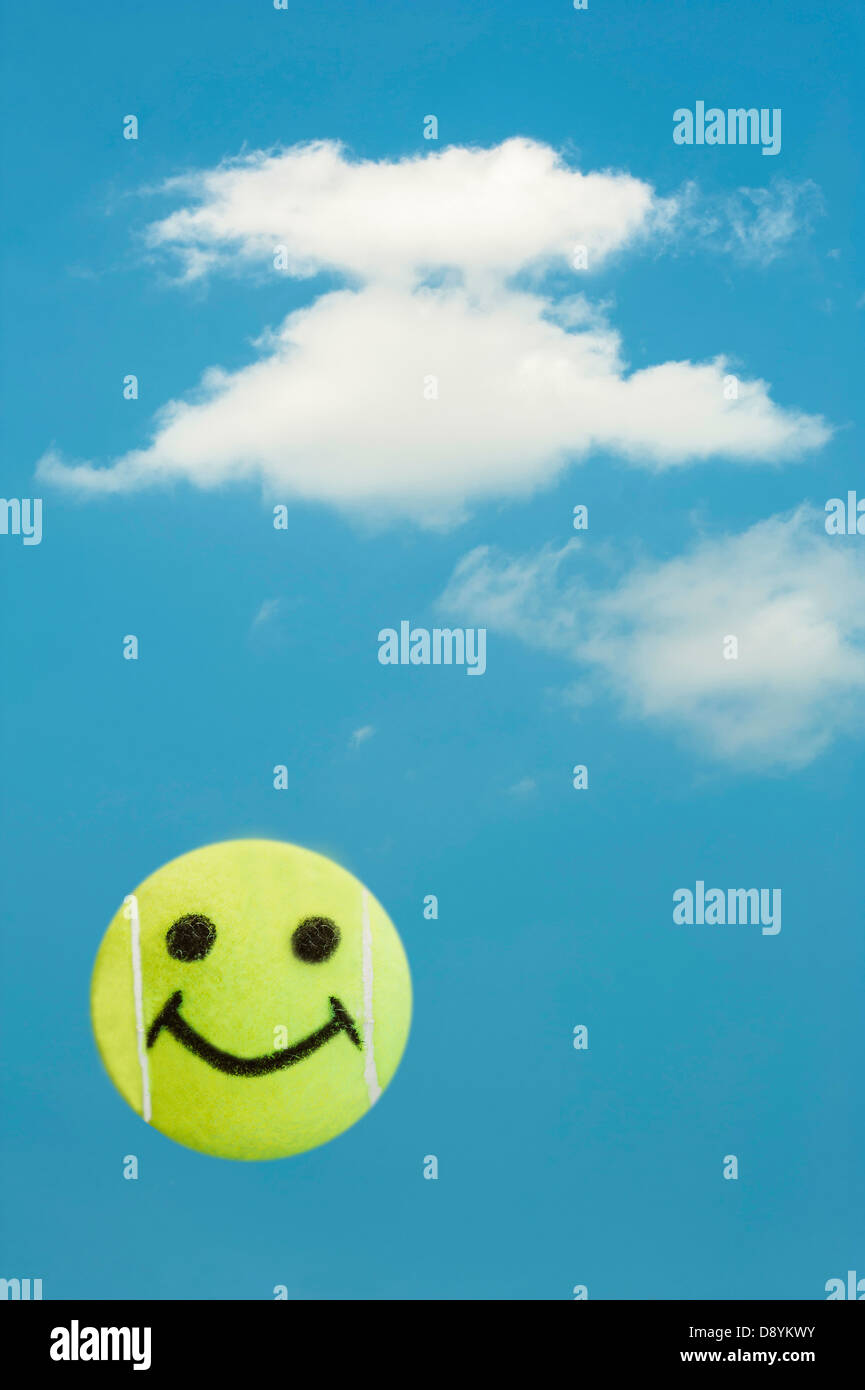 Tennis ball smiley face represents summer fun Stock Photo Alamy