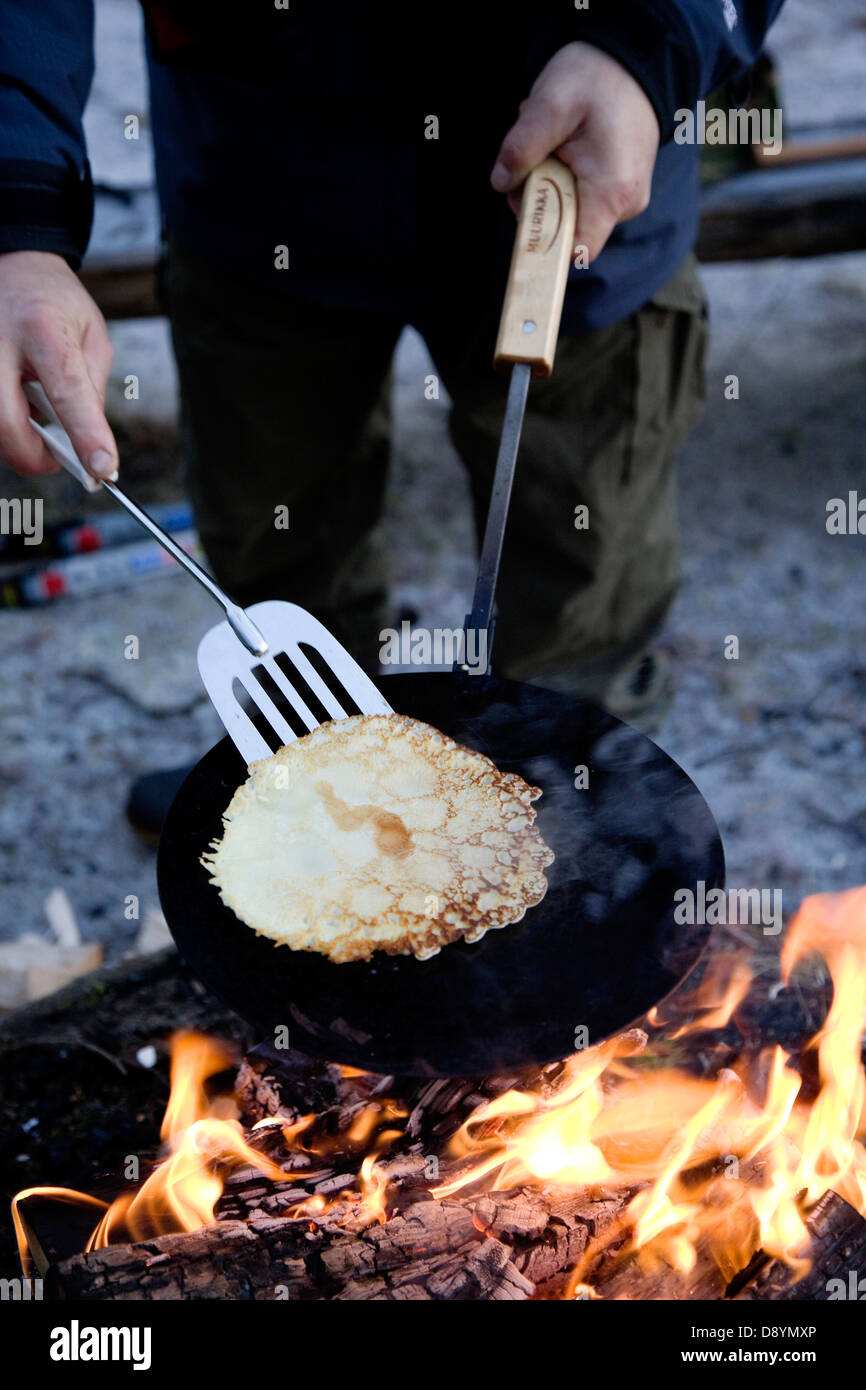 Pancakes made over open fire Stock Photo