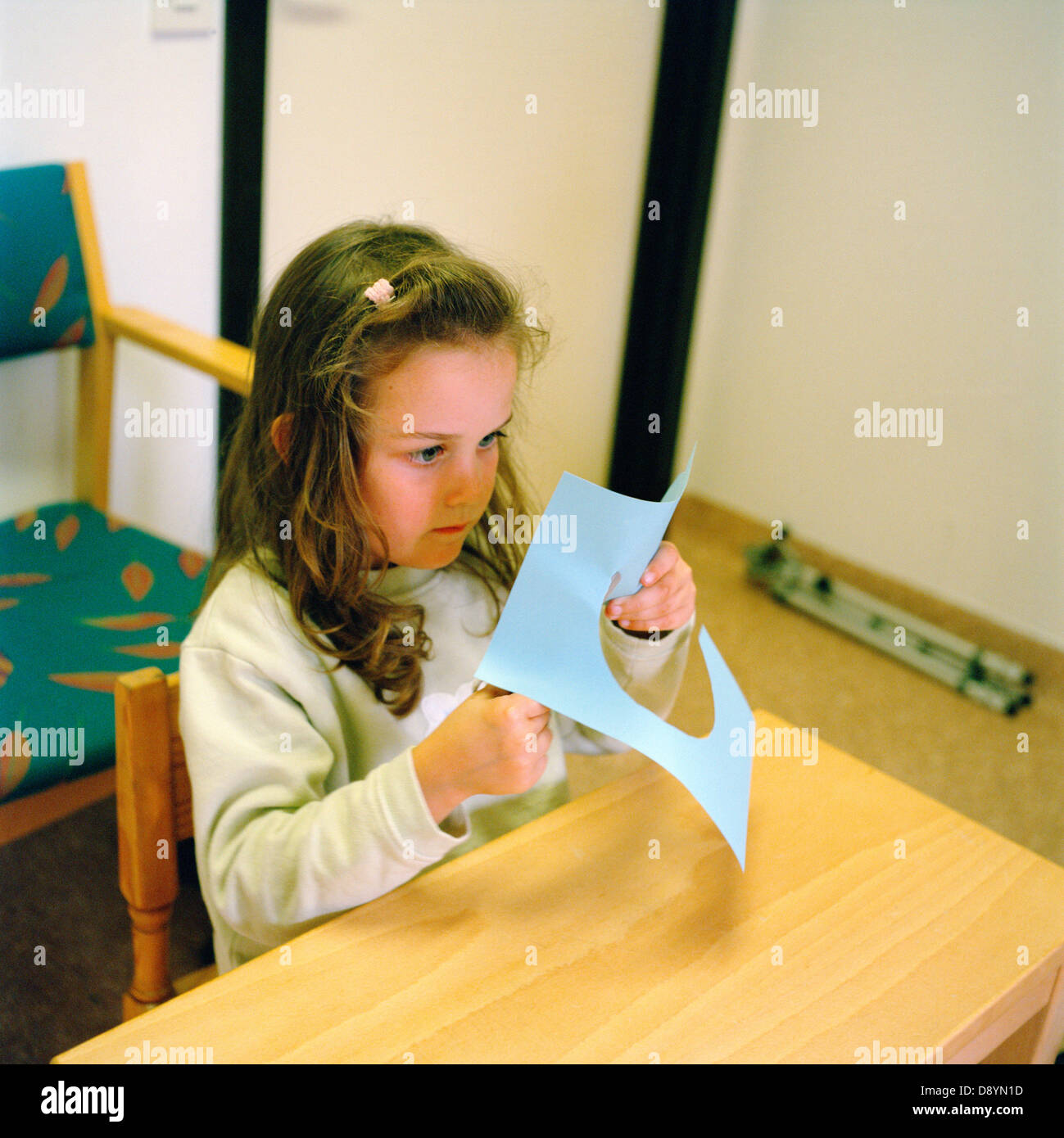 Girl cutting paper Stock Photo Alamy