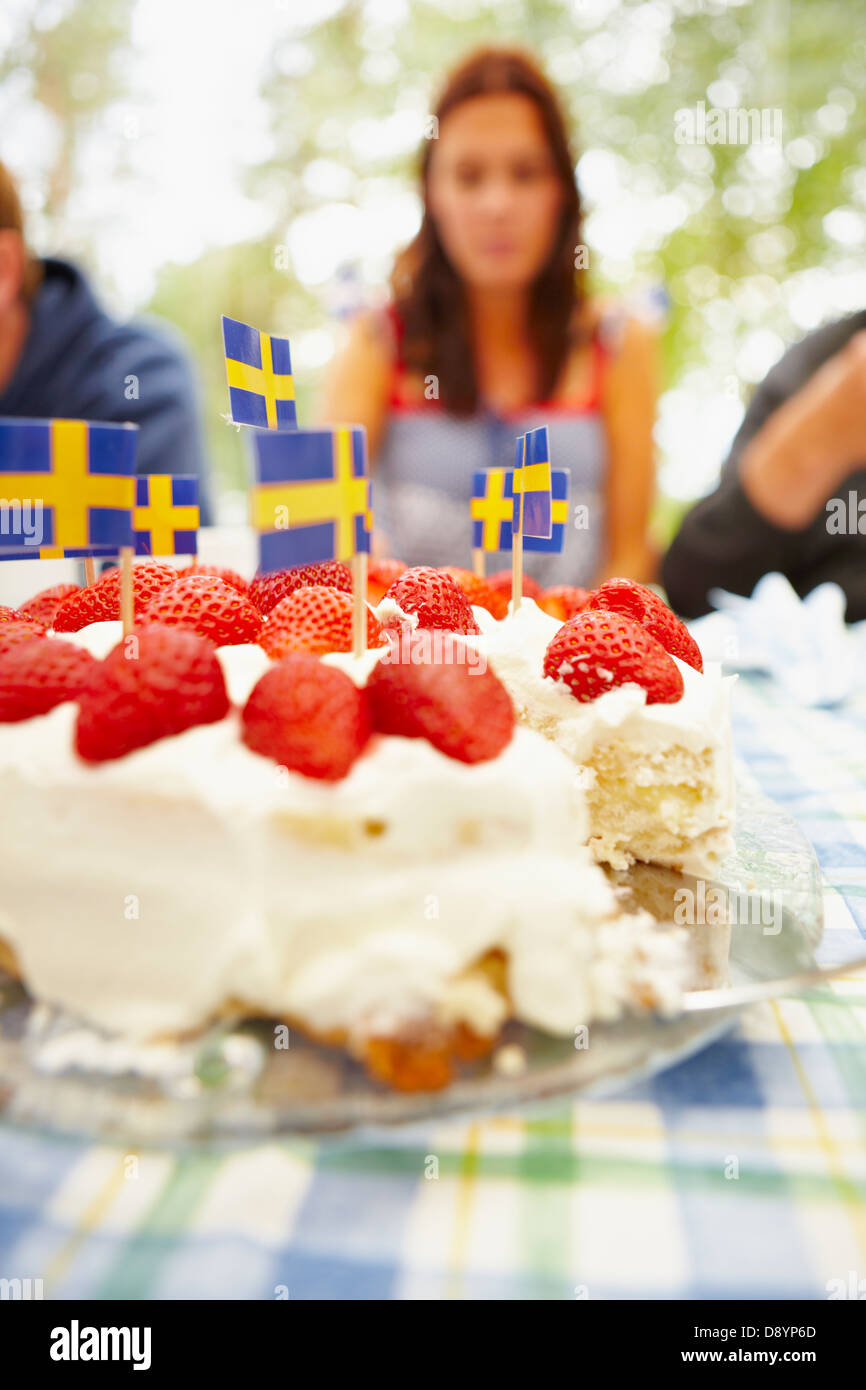 Strawberry cake with Swedish flag on table Stock Photo