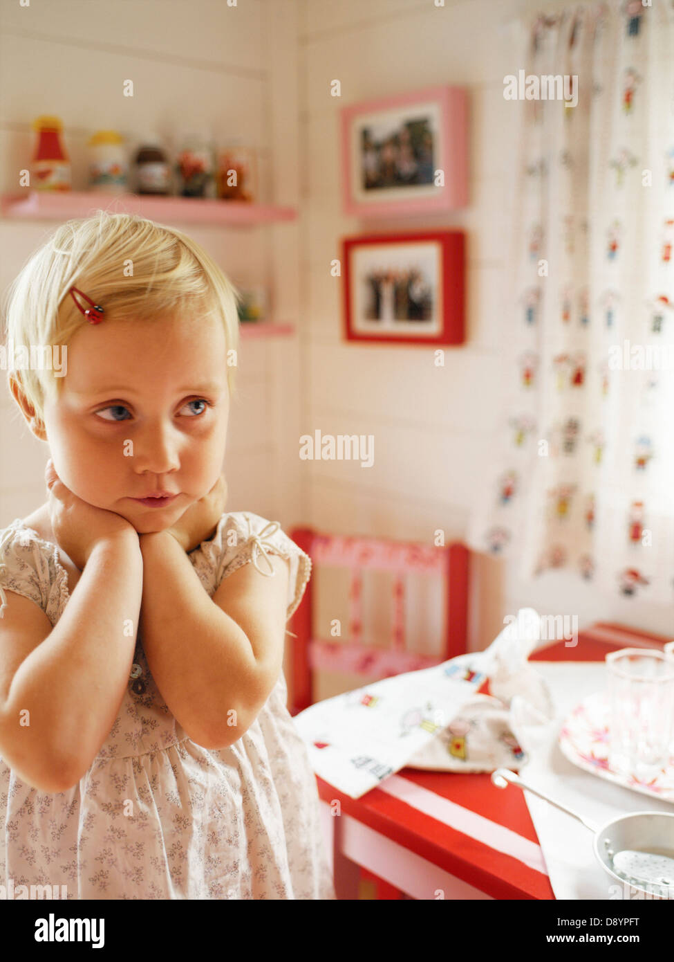 Thoughtful girl in a playhouse Stock Photo Alamy