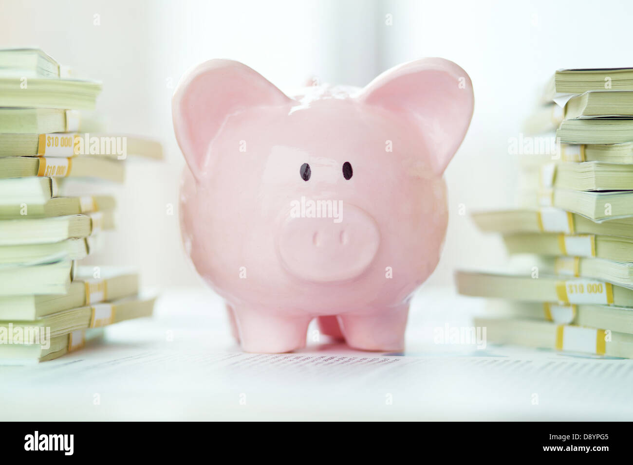 Image of pink piggy bank and stack of dollar bills Stock Photo - Alamy