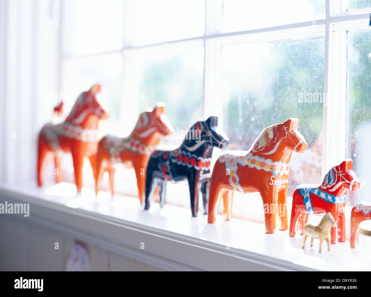 Dalecarlian horses in a window. Stock Photo