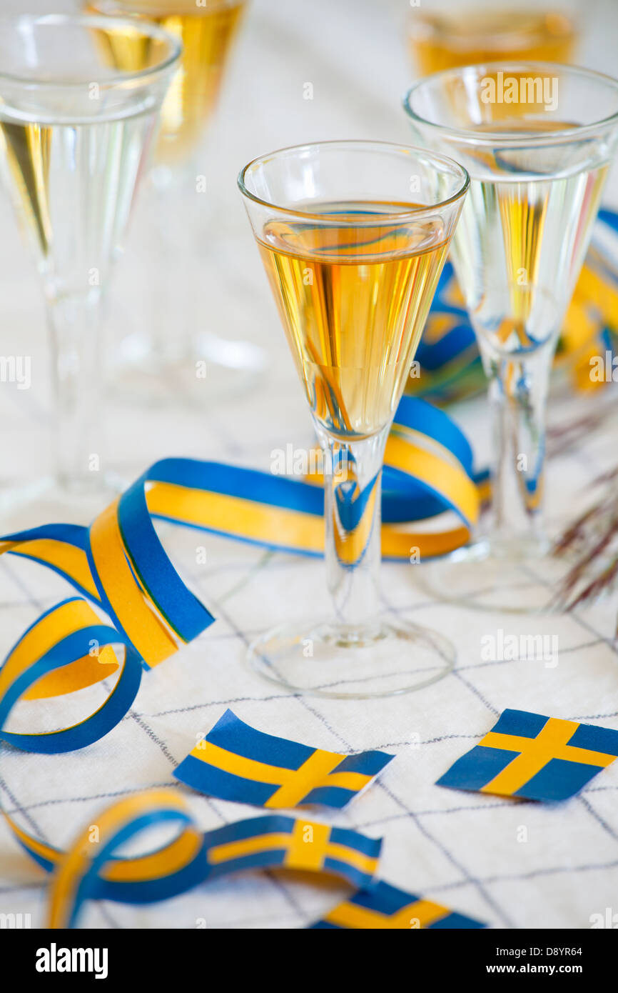 Glasses of champagne with Swedish flag on table, close-up Stock Photo