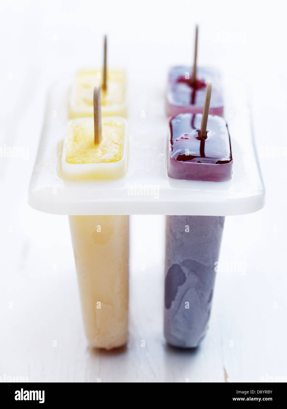Popsicles in plastic container Stock Photo Alamy