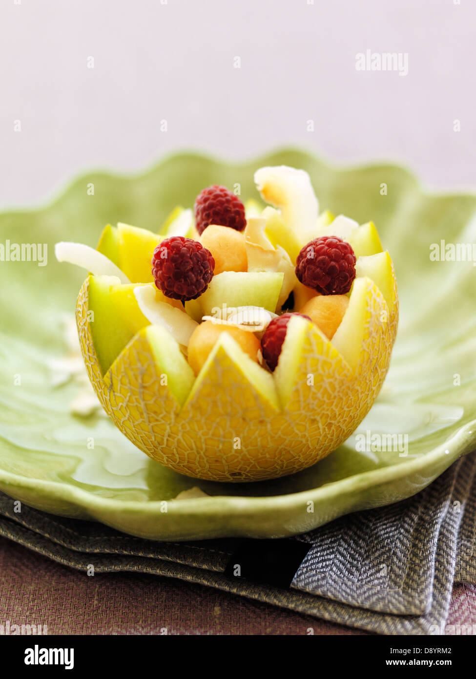 Fruit salad in melon scoop Stock Photo Alamy