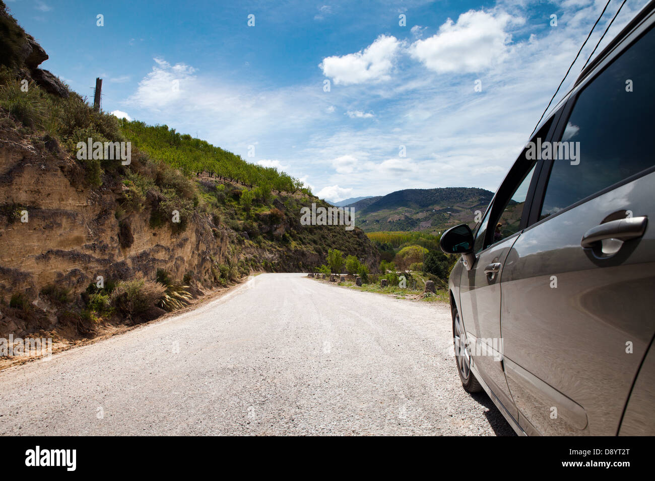 Travel by car - curvy road and beautiful landscape ahead Stock Photo