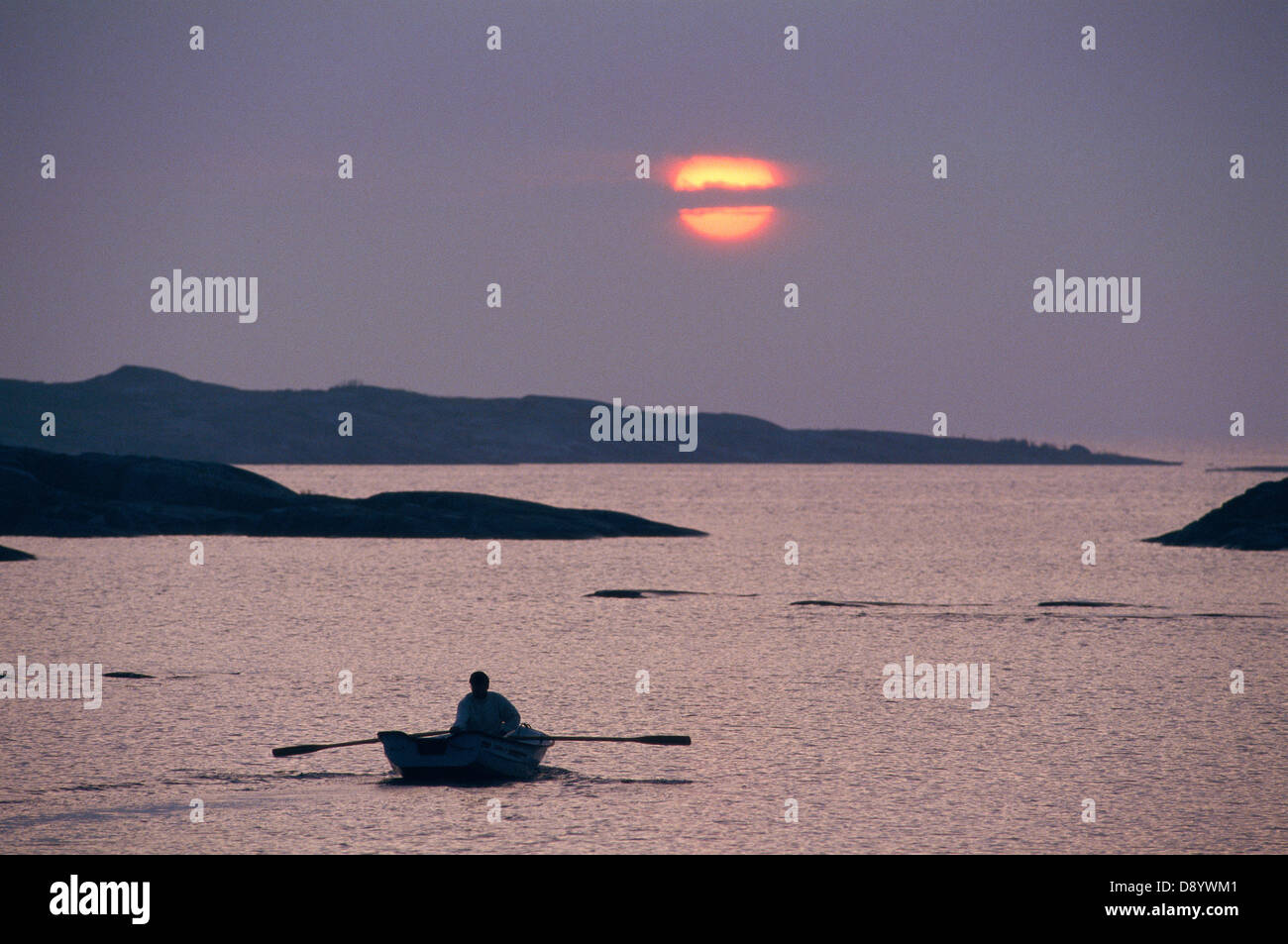 A man rowing in the archipelago Stock Photo - Alamy