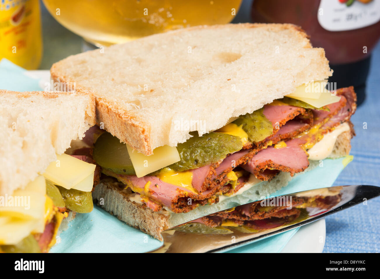 A delistyle sandwich of pastrami, Emmenthal cheese, sliced gherkins