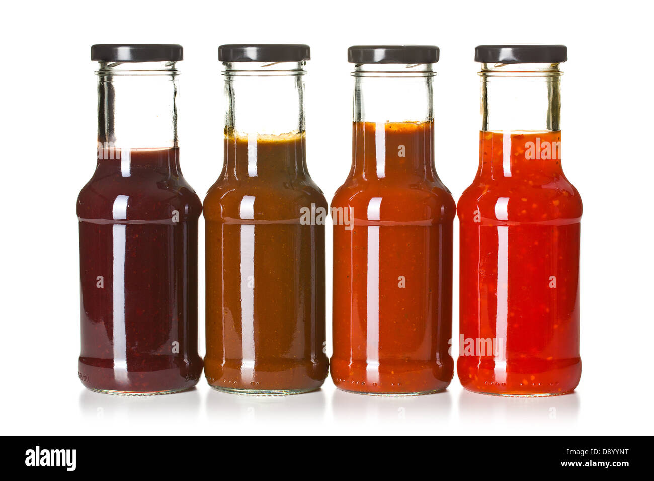 the various barbecue sauces in glass bottles Stock Photo Alamy