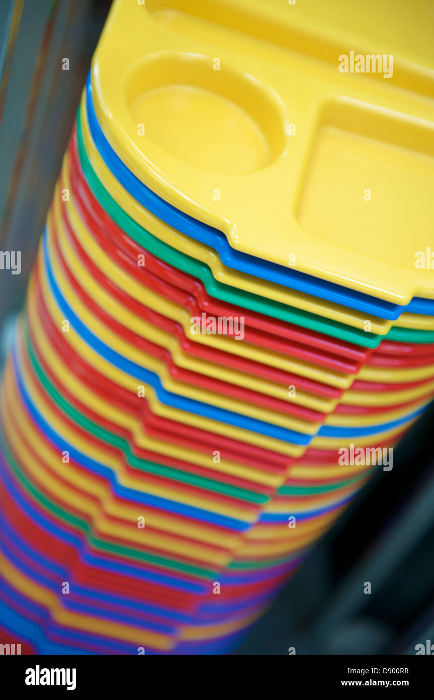 Stack of colorful trays in a school canteen Stock Photo