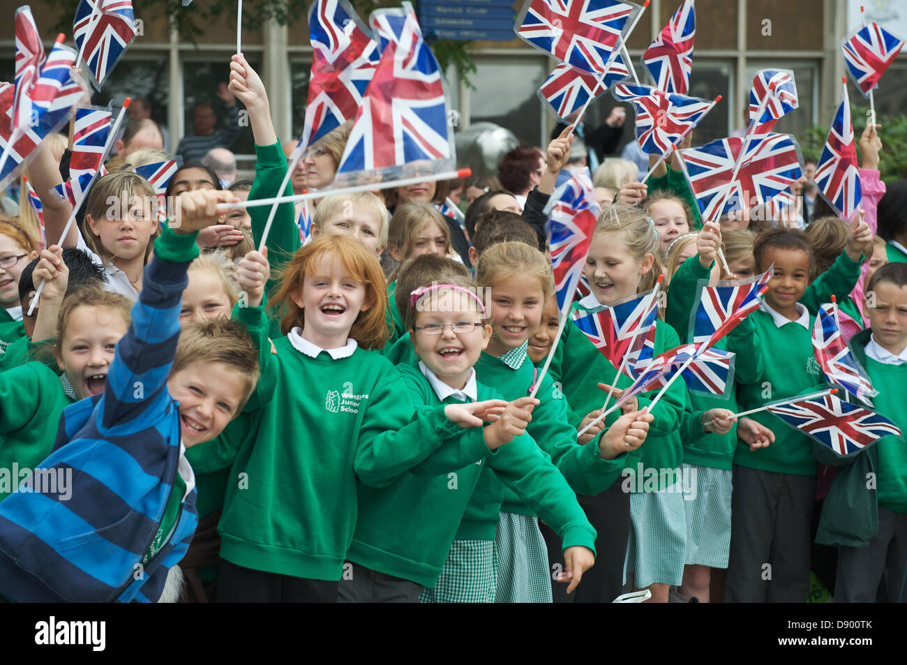 School girls waving union jacks hires stock photography and images Alamy