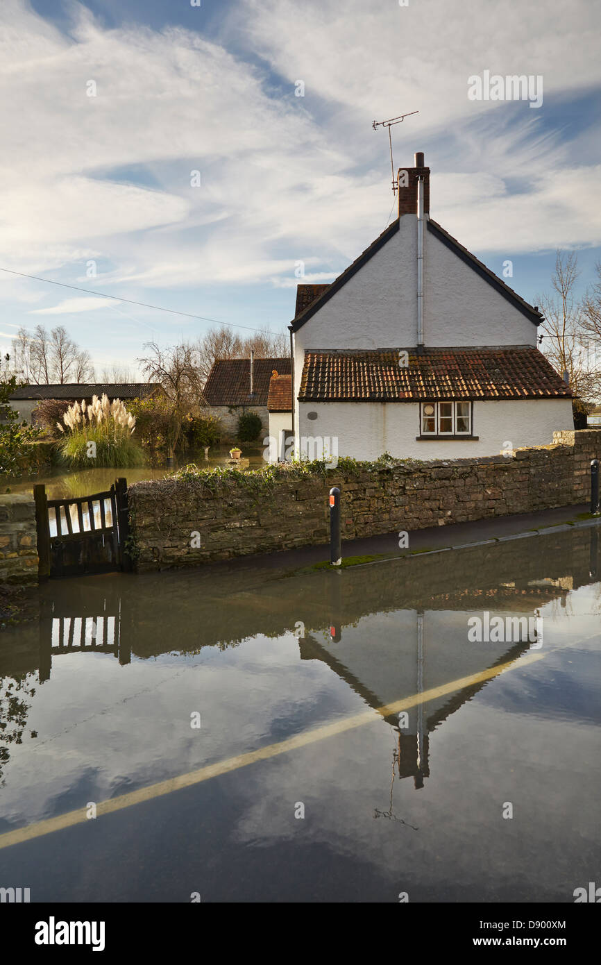A cottage flooded after heavy winter rain, at Langport, in the Somerset Levels, Somerset, Great Britain. Stock Photo