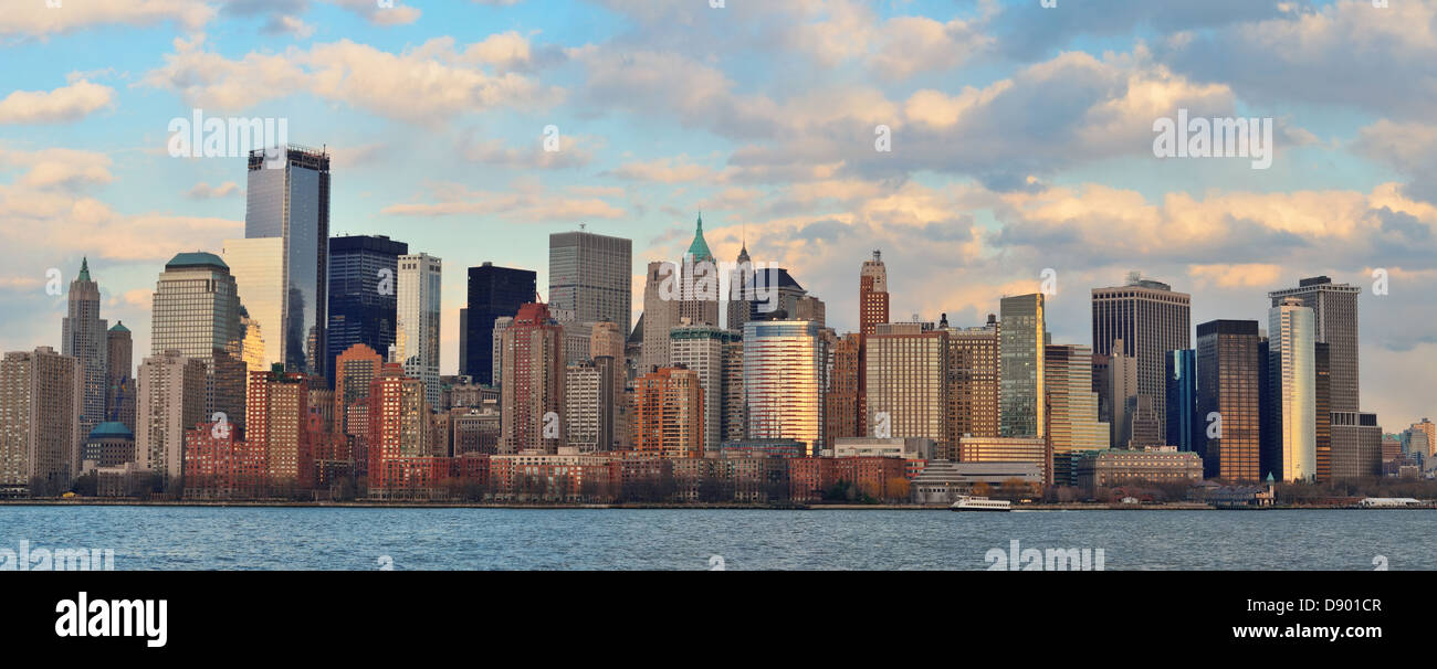 Downtown Manhattan skyline at sunset over Hudson River in New York City ...
