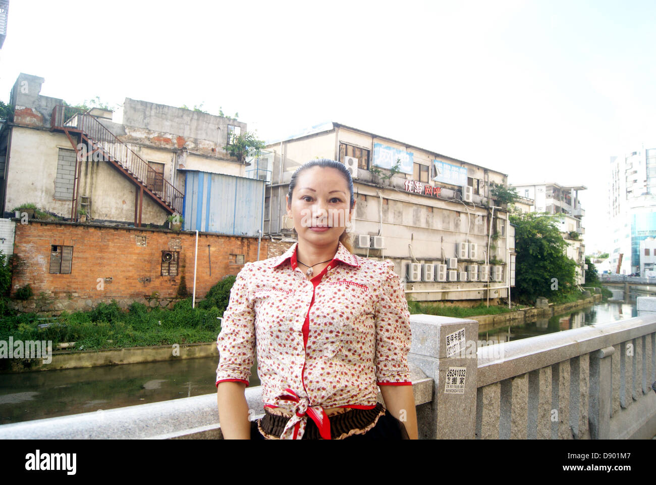 A Chinese woman, in shenzhen city xixiang, place show picture. Stock Photo