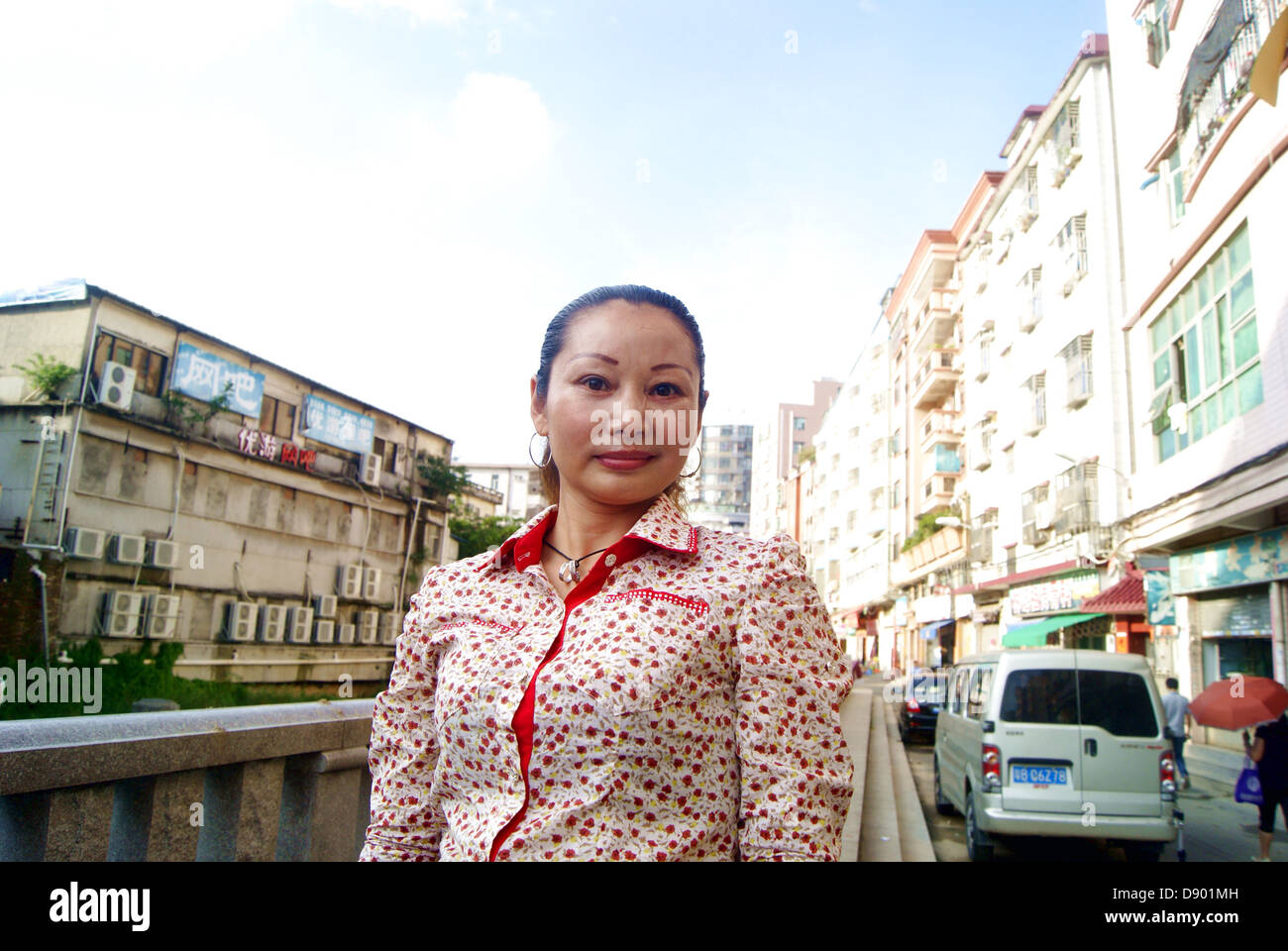 A Chinese woman, in shenzhen city xixiang, place show picture. Stock Photo
