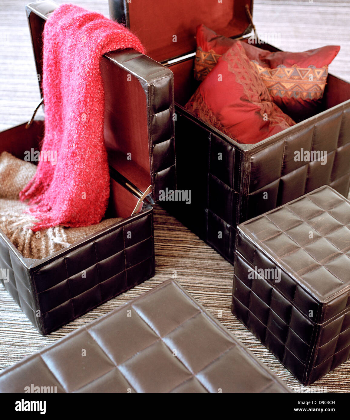 Leather storage boxes with colourful textiles Stock Photo Alamy