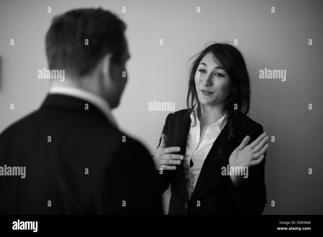 Business man and woman talking Stock Photo - Alamy