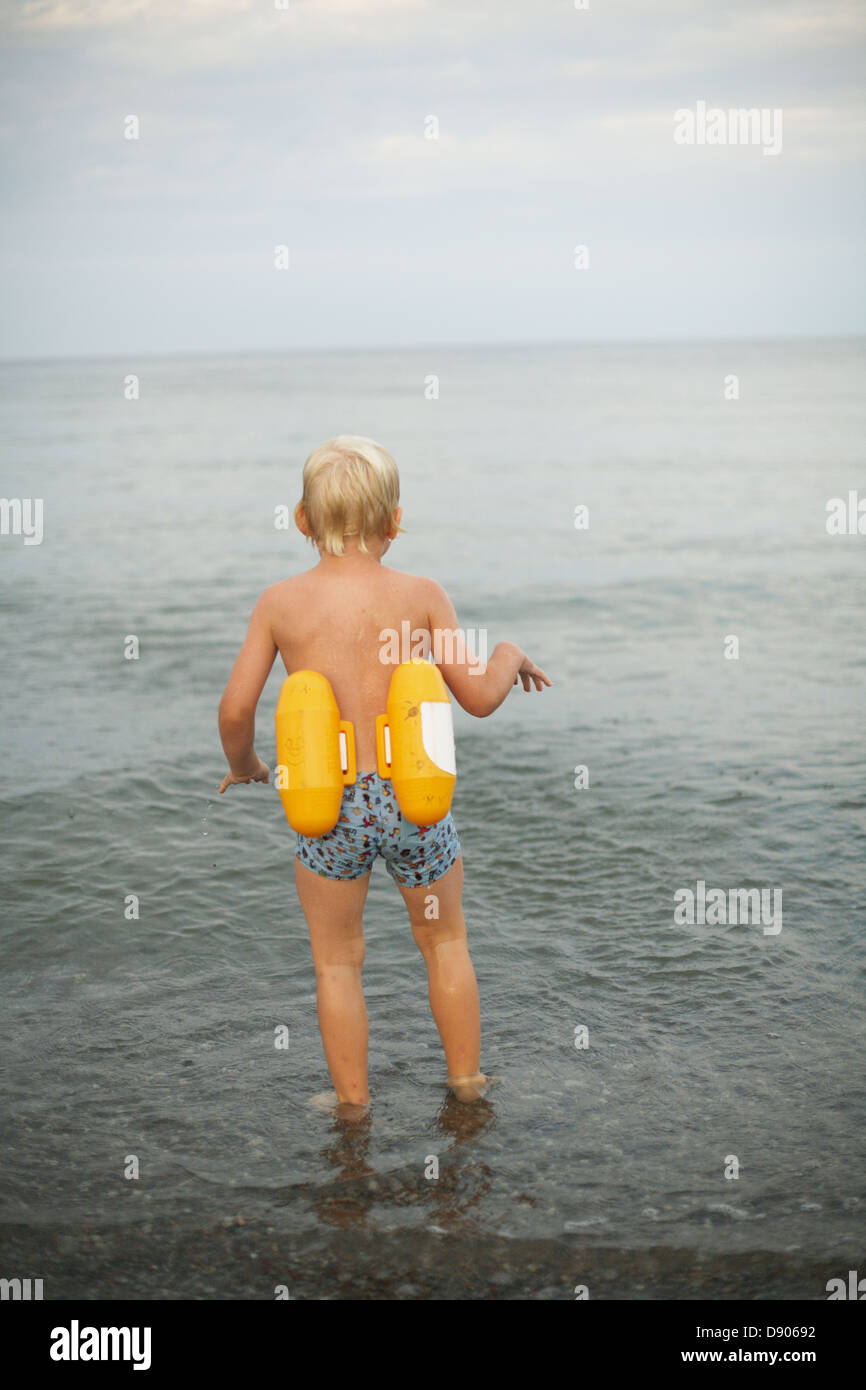 A boy about ti swim in the sea Stock Photo - Alamy