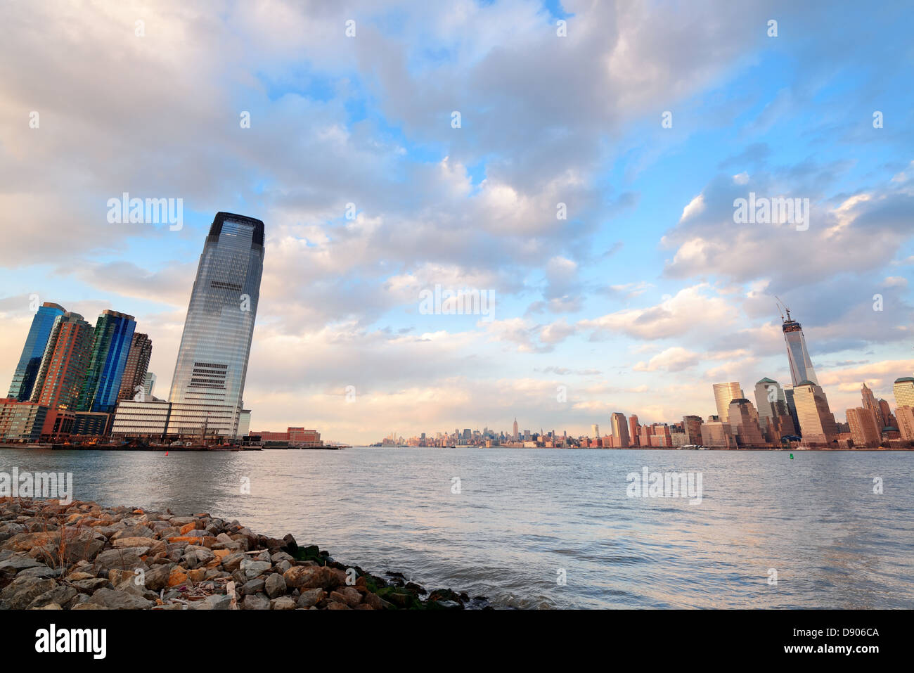 Downtown Manhattan skyline at sunset over Hudson River in New York City ...
