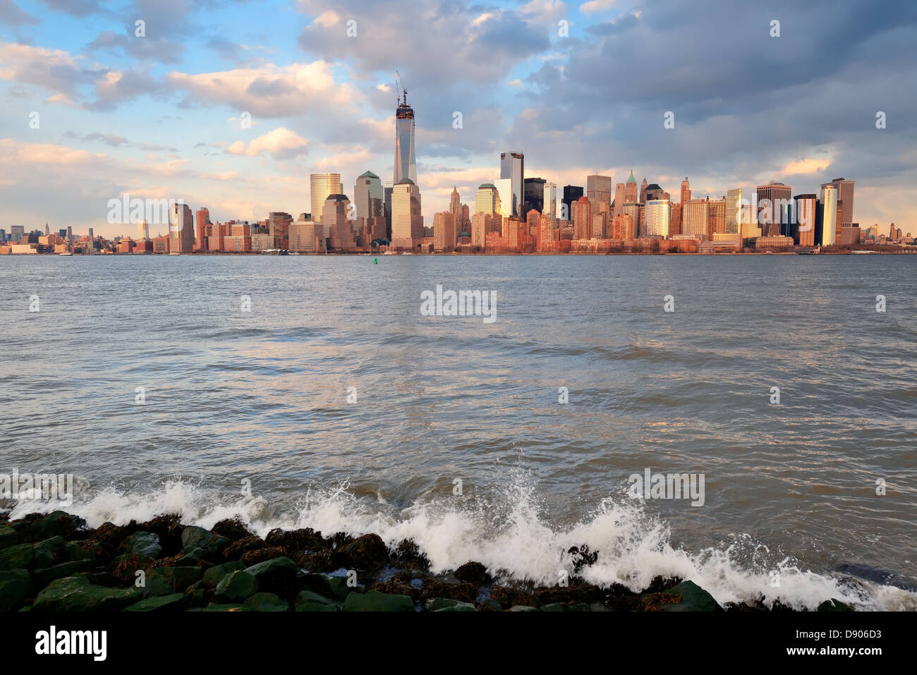 Downtown Manhattan skyline at sunset over Hudson River in New York City ...