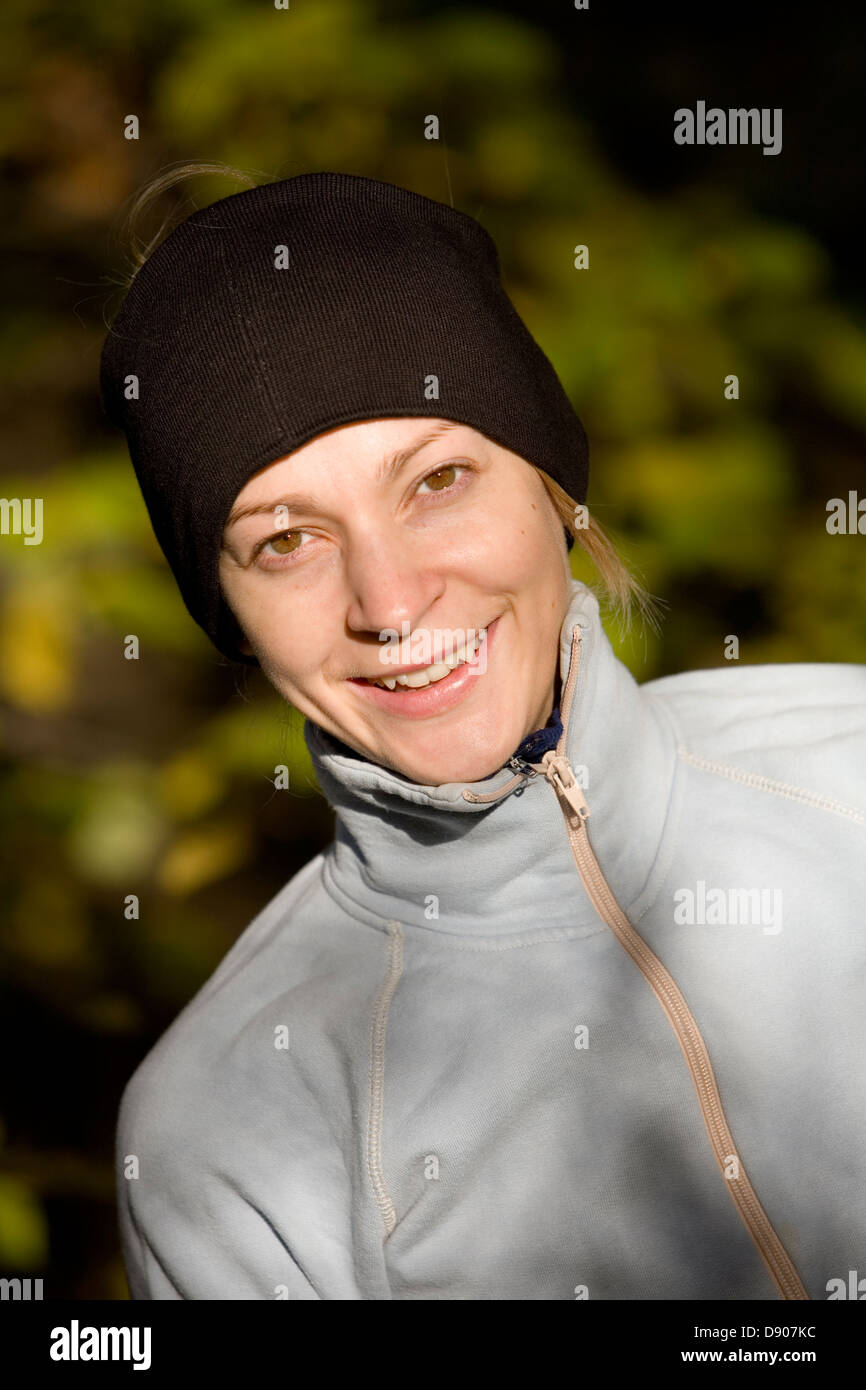 Portrait of a smiling woman outside Stock Photo - Alamy