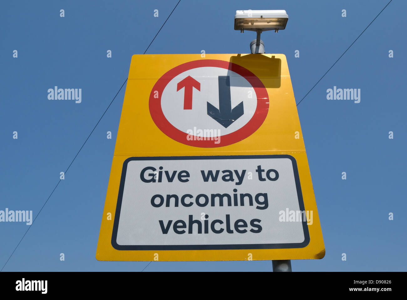 british road sign instructing drivers to give way to oncoming vehicles Stock Photo