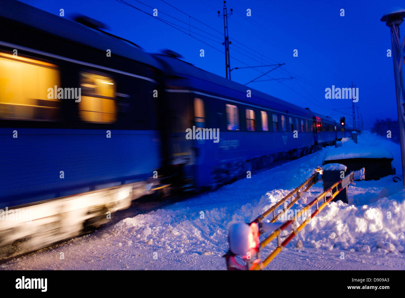 A train in motion at dusk, Sweden. Stock Photo