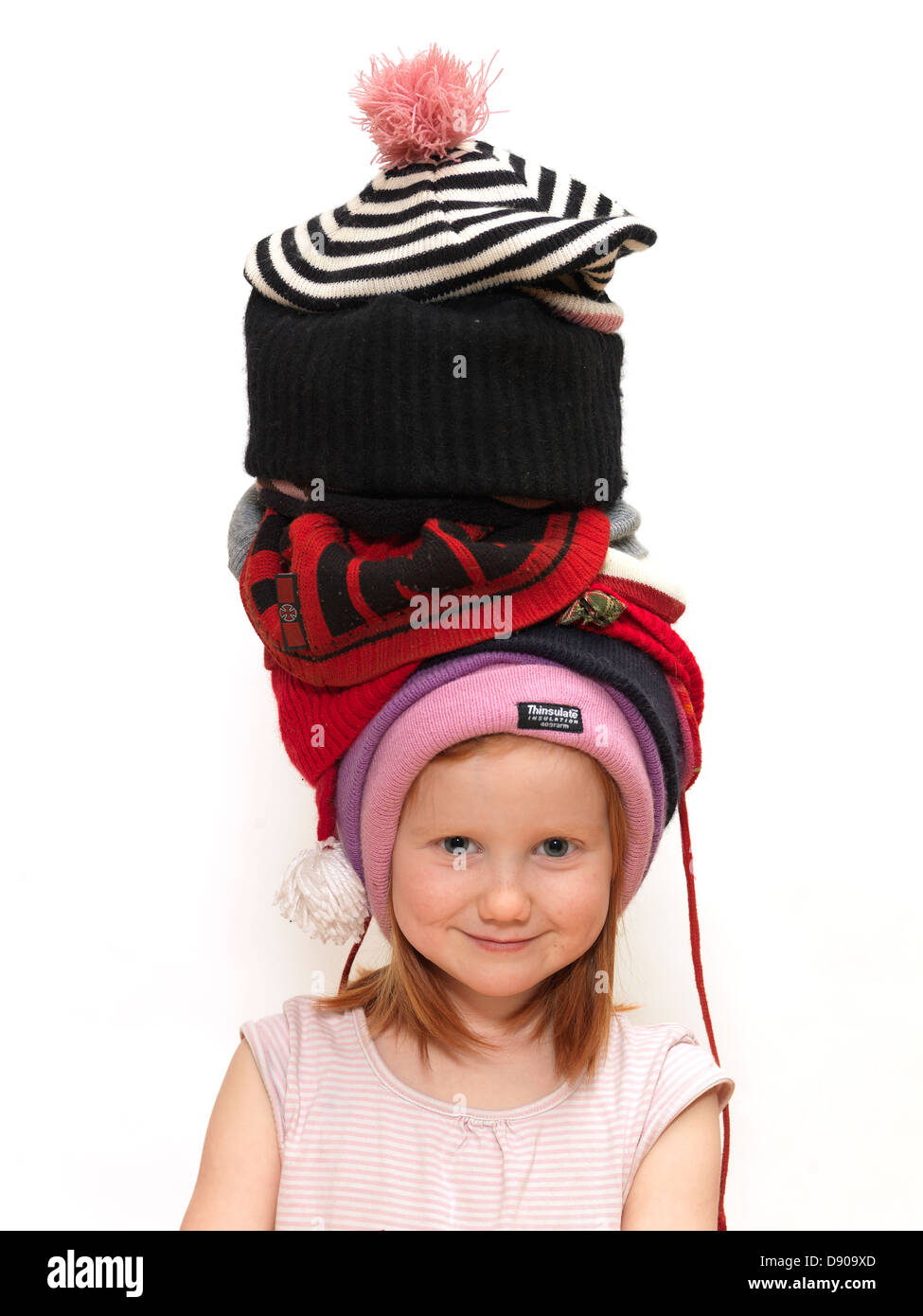 Girl wearing many caps Stock Photo Alamy