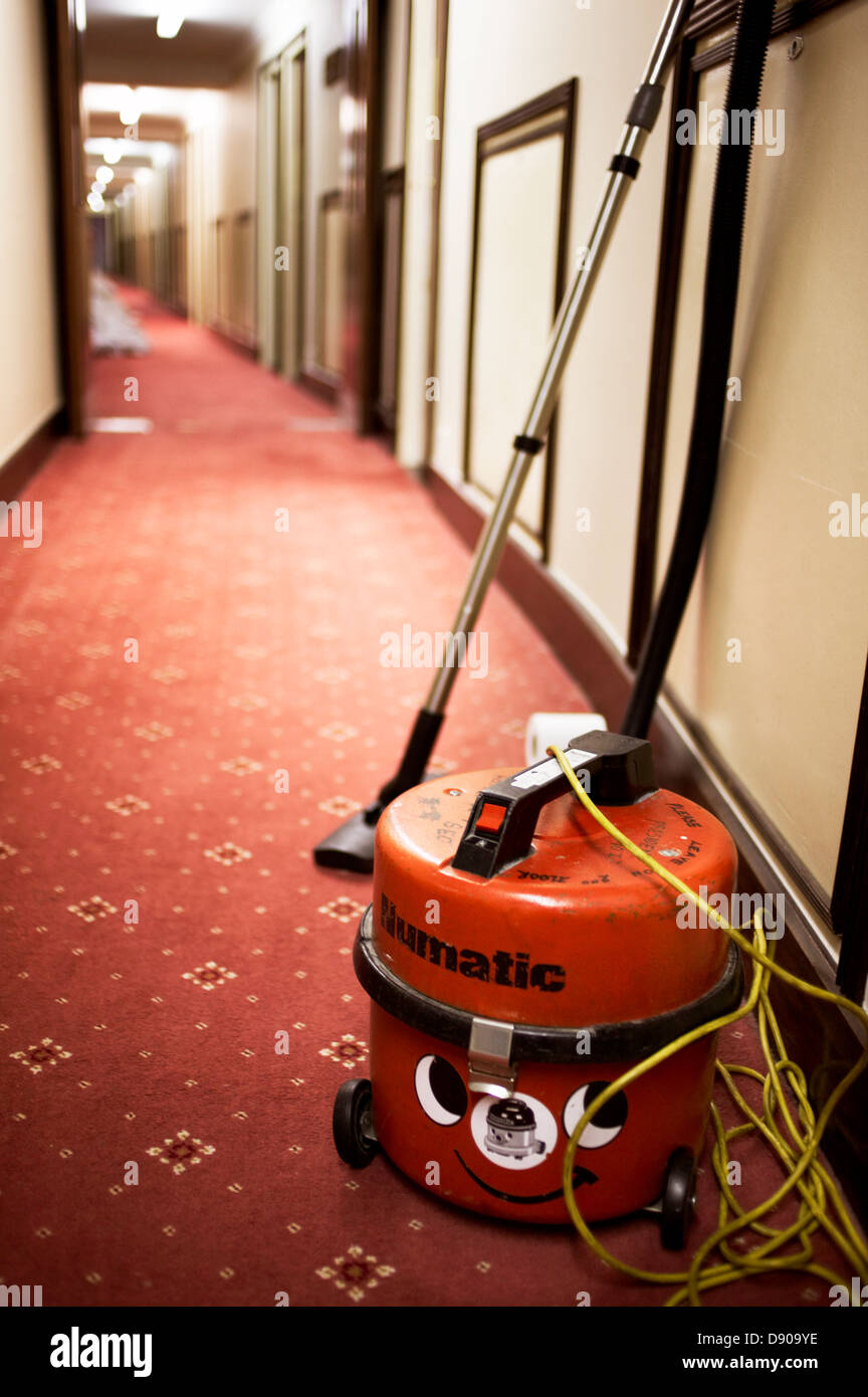 A vacuum cleaner in a hotel corridor, England. Stock Photo