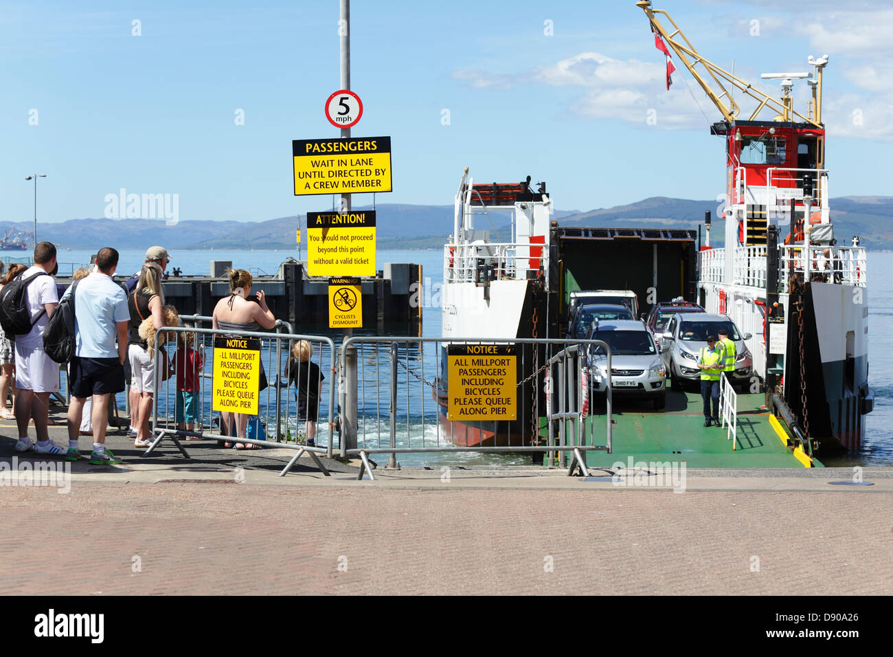 Largs Harbour, North Ayrshire, Scotland, UK, Friday, 7th June 2013. Passengers waiting on the slipway for cars to disembark before boarding a Caledonian MacBrayne Ferry to sail to the Island of Great Cumbrae in the Firth of Clyde Stock Photo