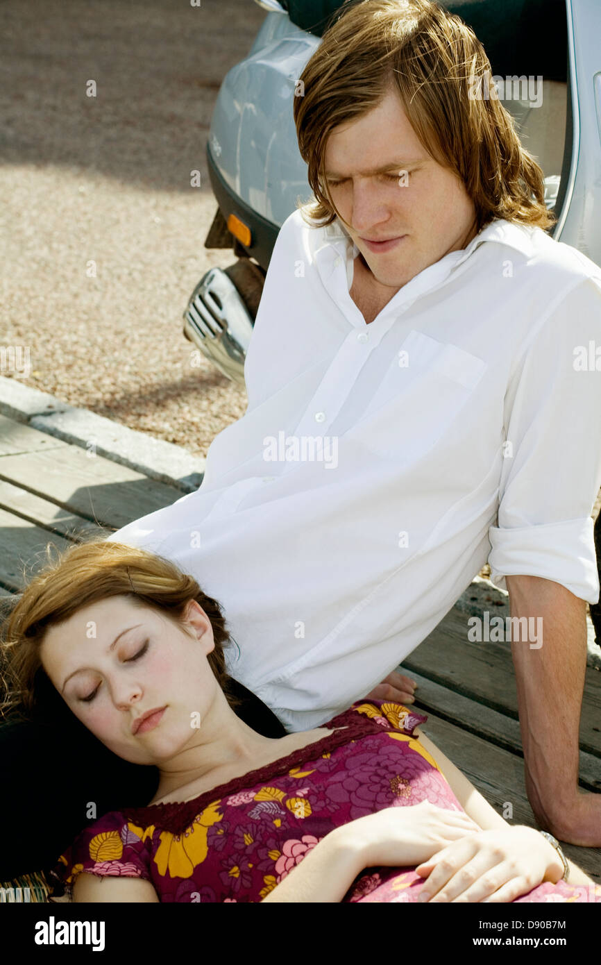 Young couple sleeping on bench hi-res stock photography and images - Alamy