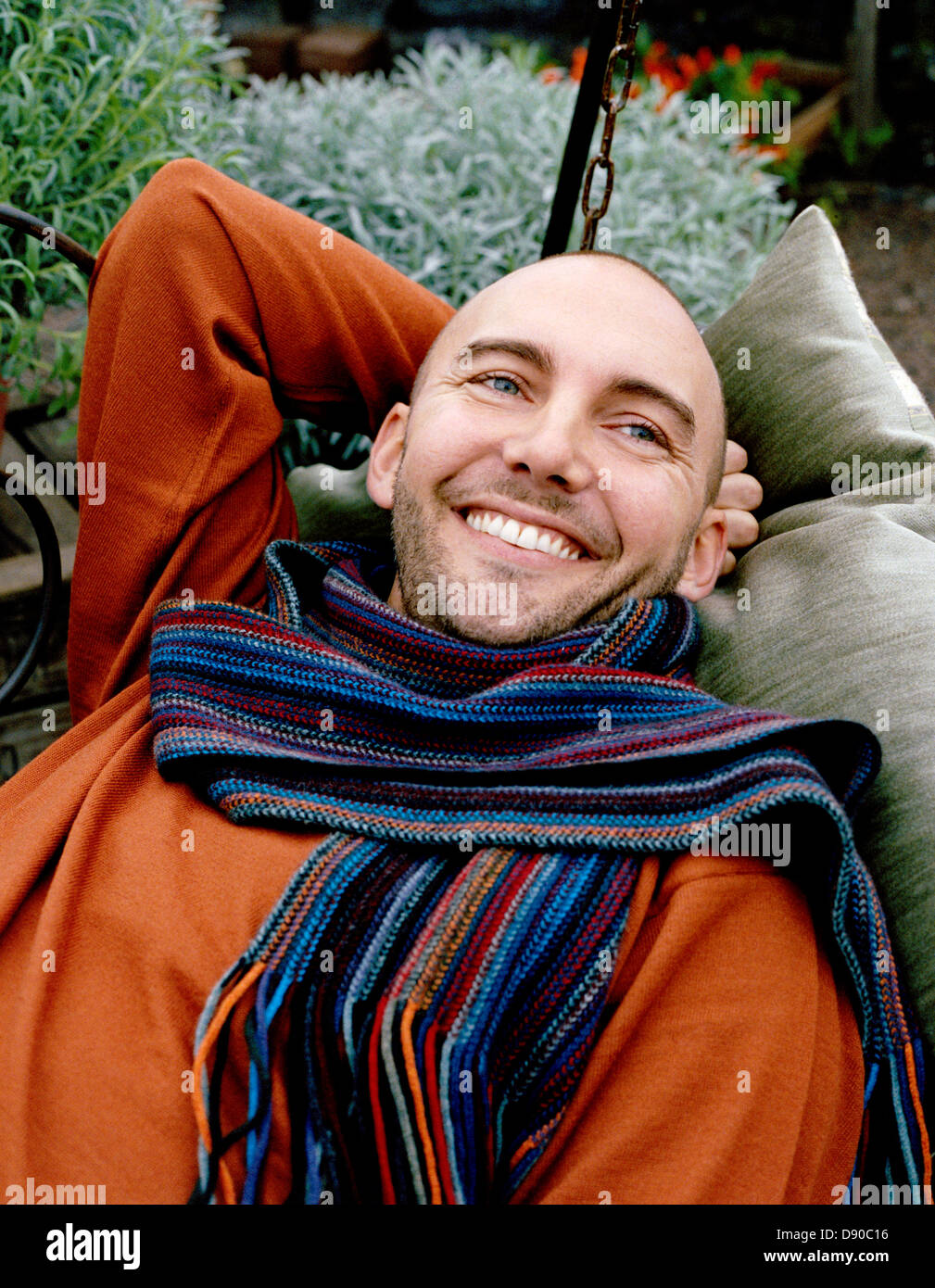 Portrait of a smiling man wearing a scarf, Sweden. Stock Photo