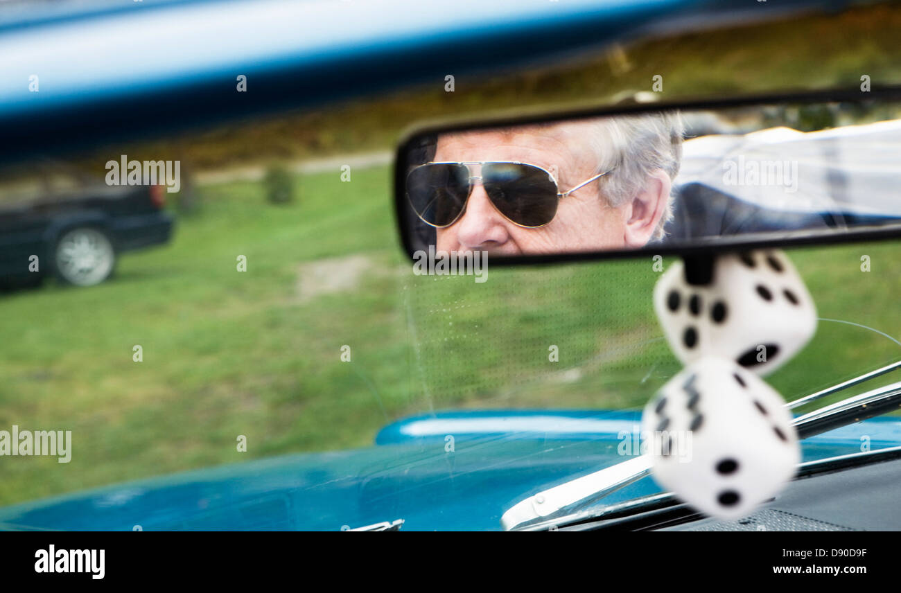 The image of a man seen in a rear-view mirror Stock Photo - Alamy
