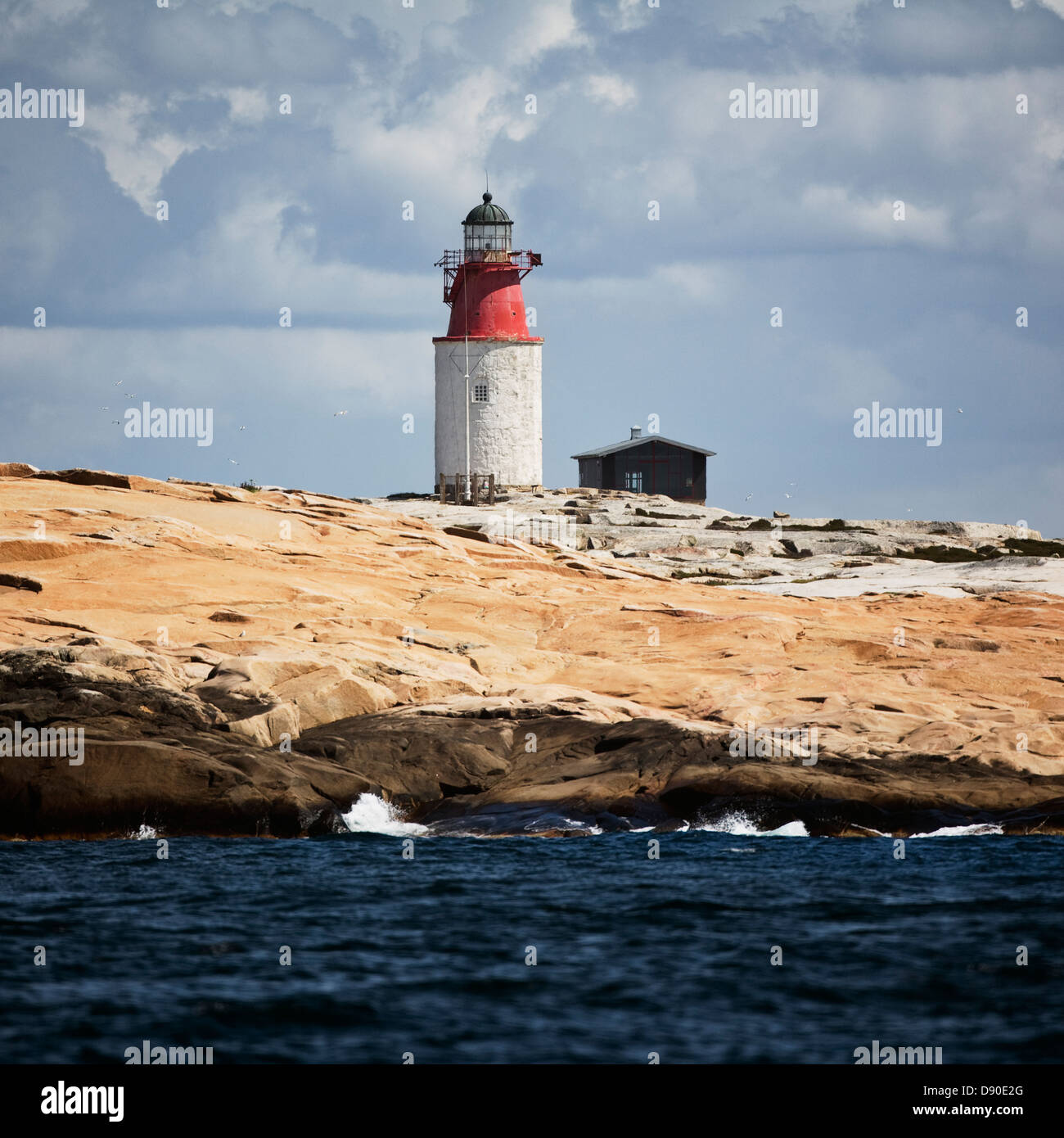 lighthouse-on-rocky-coast-stock-photo-alamy