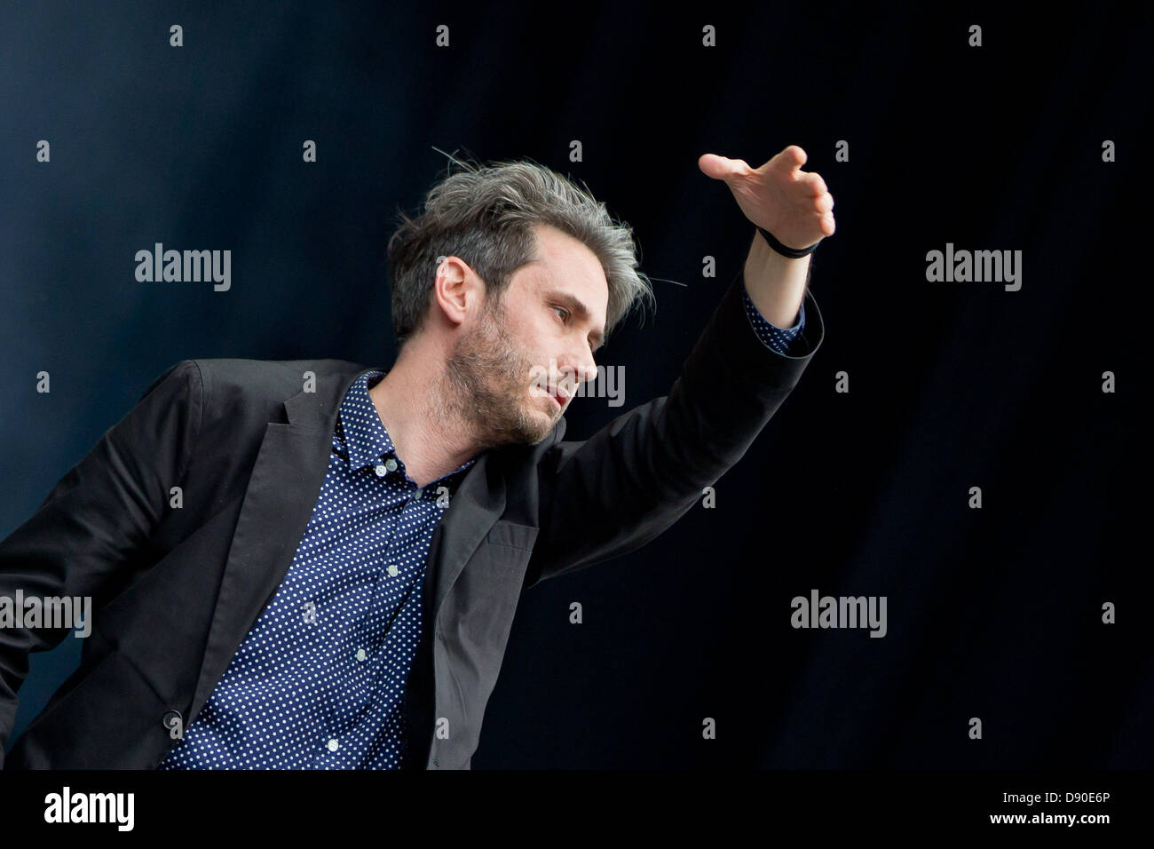 Nuremberg, Germany. 7th June 2013. Front man of German band Tocotronic, Dirk von Lowtzow, performs at the music festival 'Rock im Park' in Nuremberg, Germany, 07 June 2013. Over 70,000 rock musicians are expected to the festival which continues until 09 June. Photo: DANIEL KARMANN/dpa/Alamy Live News Stock Photo