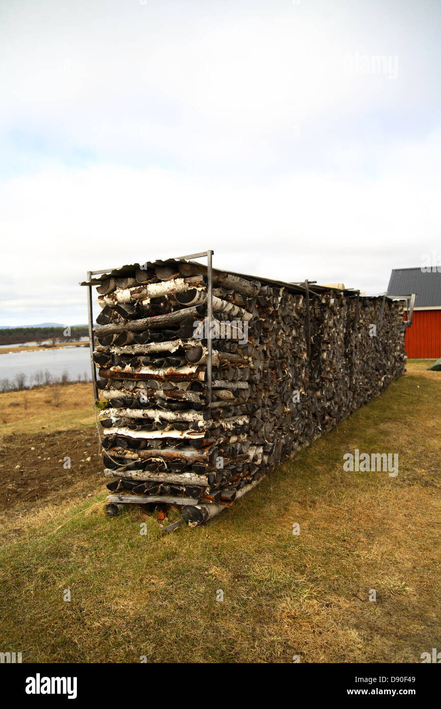 Stack of fire wood, Norrbotten, Sweden. Stock Photo