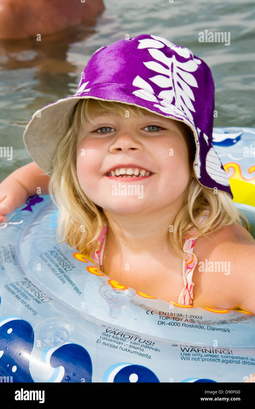 Girl floating on inner tube Stock Photo Alamy
