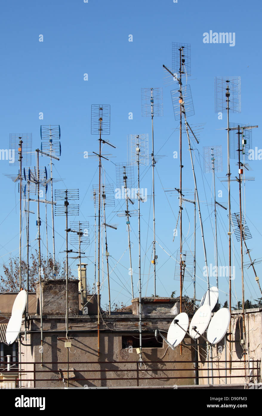 Many home TV antennas mounted on a roof Stock Photo