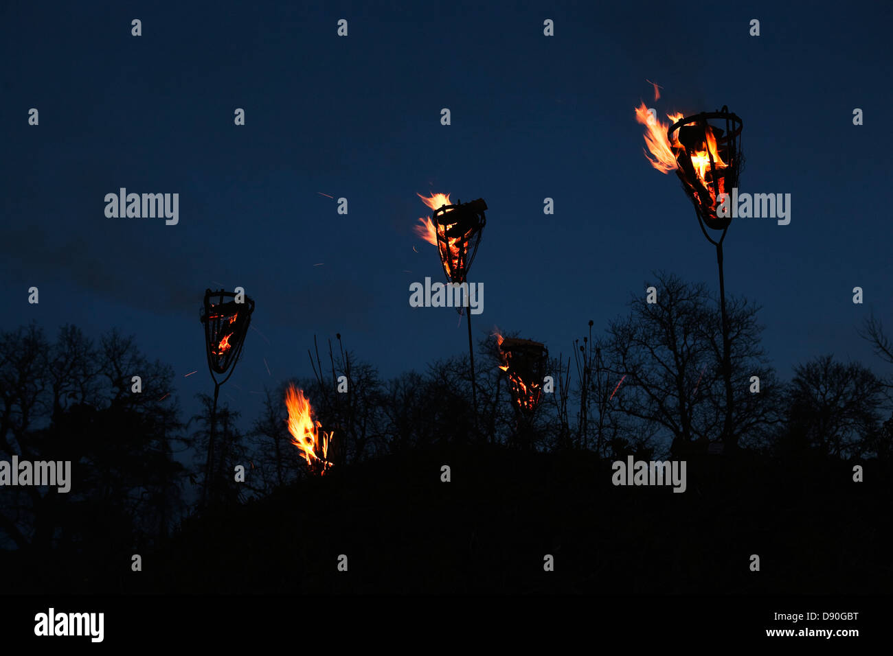 Burning torches at night, Sweden. Stock Photo