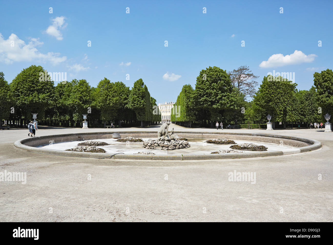 Vienna Schonbrunn palace from a tree lined avenue fountain Stock Photo