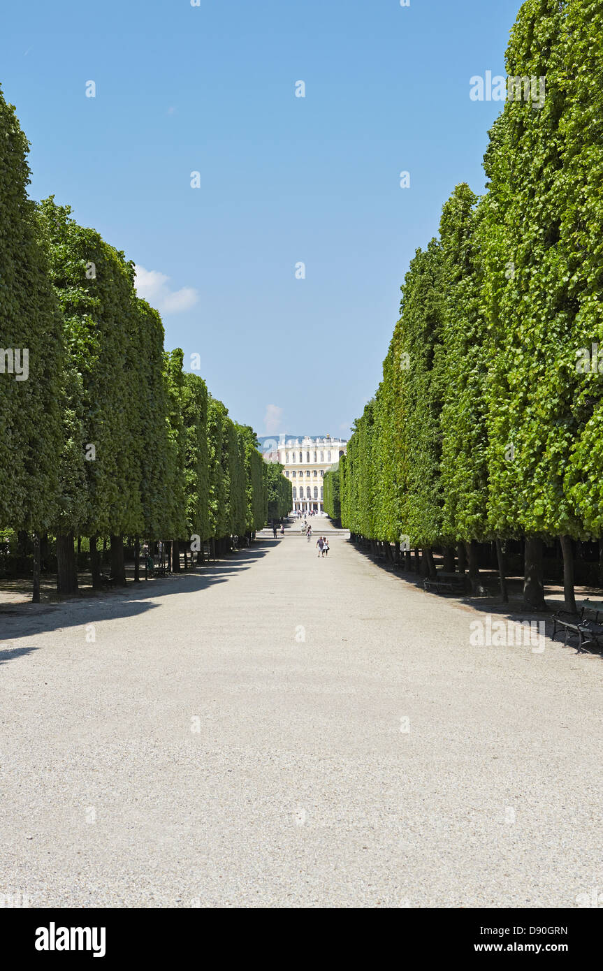 Vienna Schonbrunn palace from a tree lined avenue Stock Photo