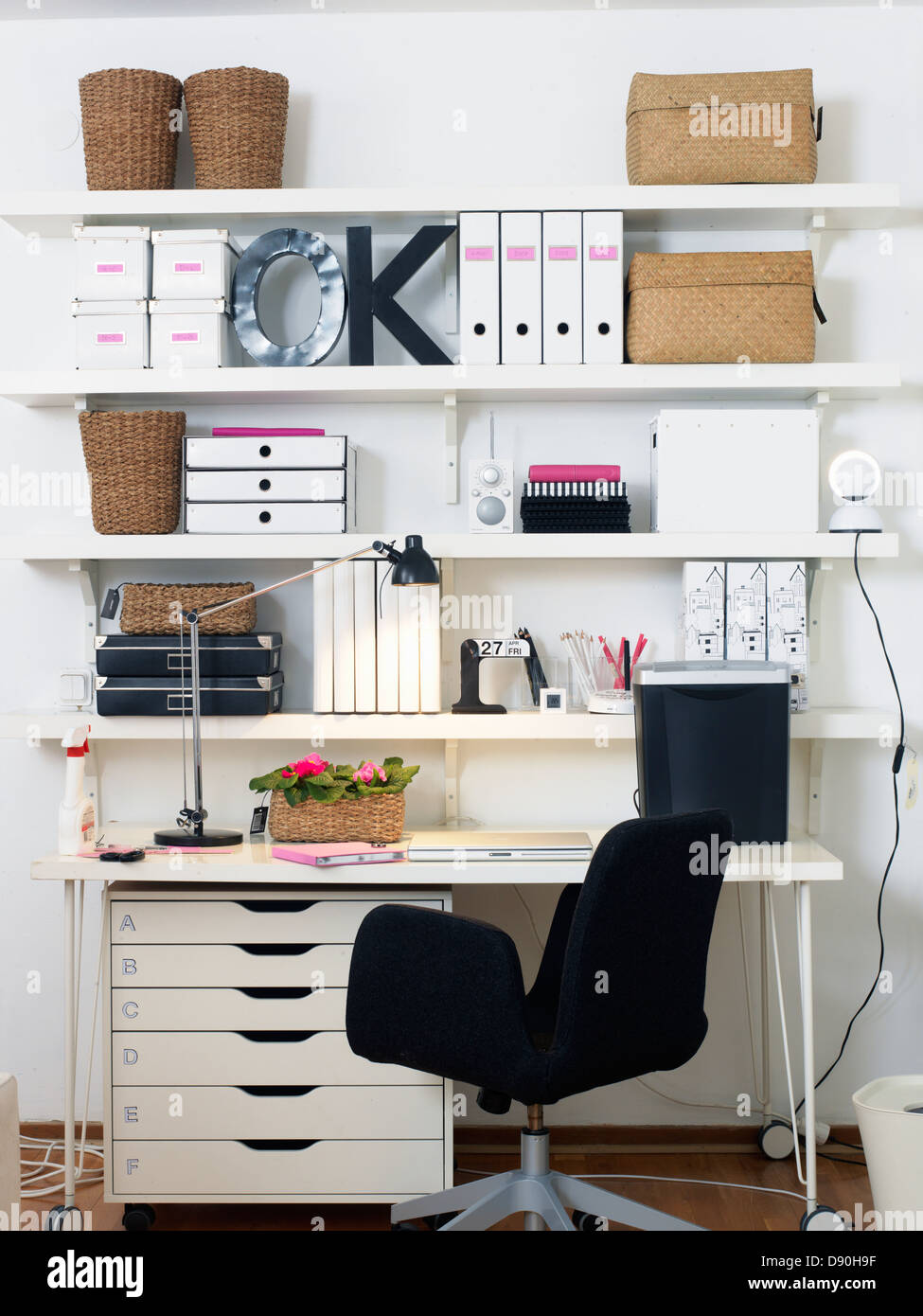 Office chair and table with shelf Stock Photo Alamy
